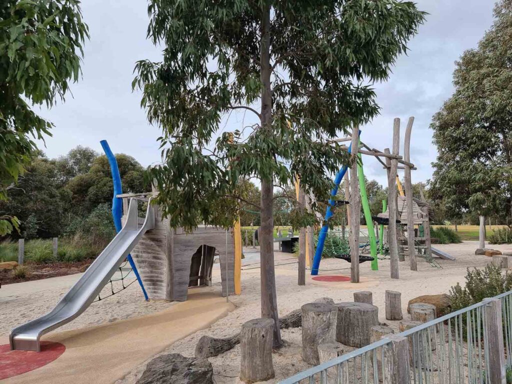 wooden playground with slide at warralily boulevard playground geelong
